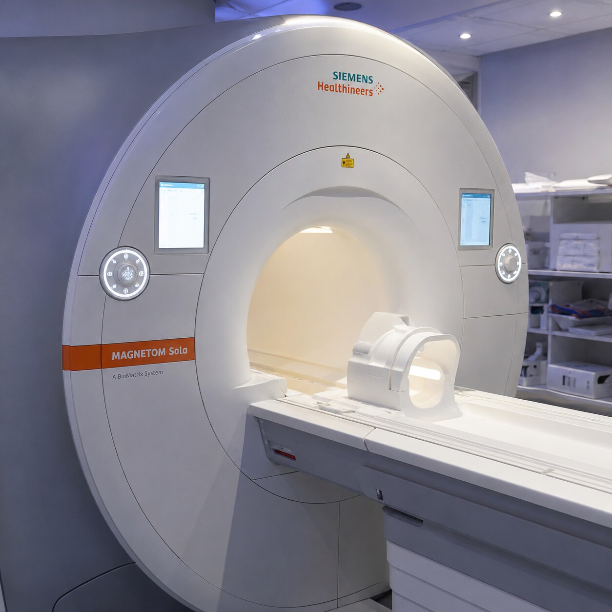 A patient being positioned for an MRI scan in a clinical imaging suite, the modern diagnostic tool used to visualize prostate zones a physical exam cannot reach